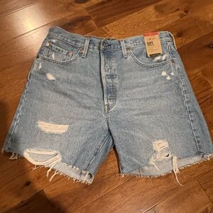 Levi’s 501 mid-thigh frayed jean shorts